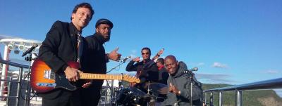 Brian Moor aboard the Queen Mary 2 and a band he played with on board